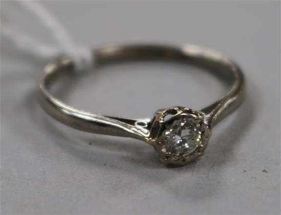 An 18ct white gold and solitaire diamond ring, size P.